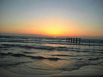 Scenic view of sea at sunset