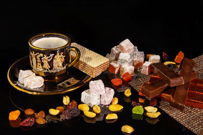 High angle view of drink on table against black background