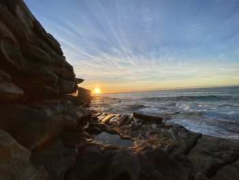 Scenic view of sea against sky during sunset