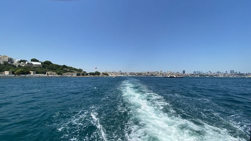 Scenic view of sea against clear blue sky