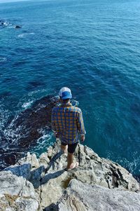 Rear view of man looking at sea