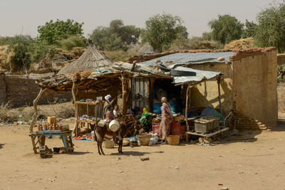 Panoramic view of people at observation point against trees