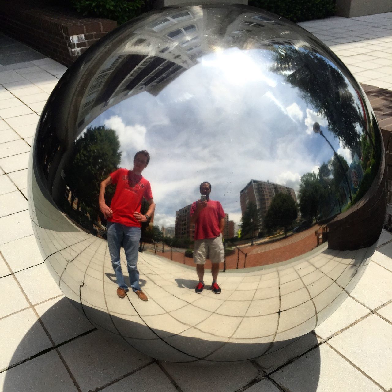 lifestyles, full length, sky, leisure activity, cloud - sky, rear view, men, fish-eye lens, circle, casual clothing, walking, standing, boys, built structure, architecture, childhood, building exterior, person