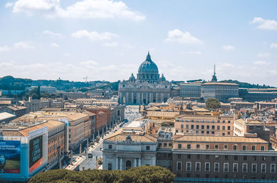 St peter basilica amidst buildings city