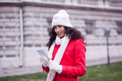 Portrait of woman standing in snow