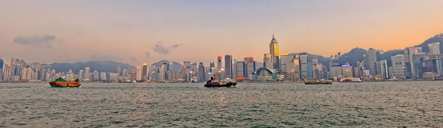 Panoramic view of buildings against sky during sunset