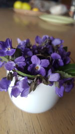 Close-up of purple flowers on table