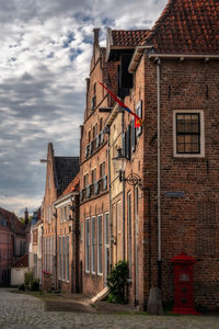 Old building against cloudy sky