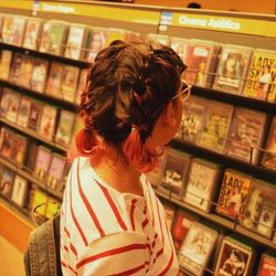 Rear view of young woman looking away