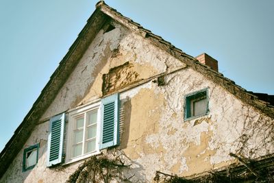 Low angle view of old building against clear sky