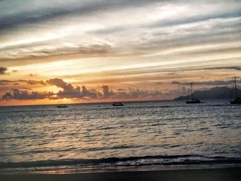 Scenic view of sea against cloudy sky