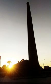 Silhouette of monument at sunset