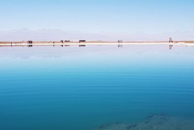 Scenic view of sea against clear blue sky