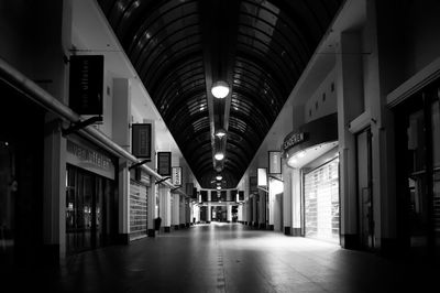 A busy shopping mall during an evening curfew