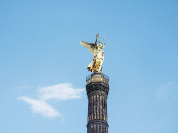 Low angle view of statue of liberty against sky