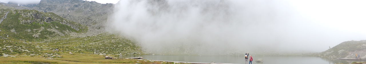 Panoramic view of waterfall against sky