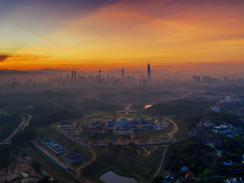 High angle view of city buildings during sunset