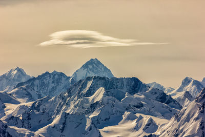 Scenic view of snow mountains against sky