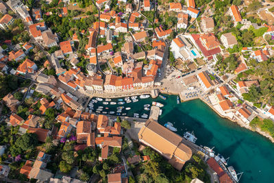 High angle view of canal amidst buildings in city