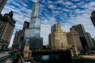 Modern buildings against cloudy sky