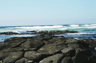 Scenic view of sea against clear sky