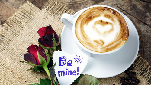 Close-up of cappuccino served on table