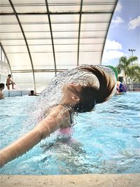 People enjoying in swimming pool