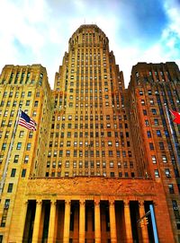 Low angle view of modern buildings against sky in city