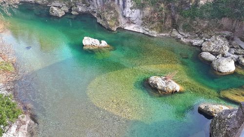 High angle view of rock formation in sea