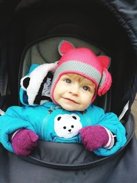 Portrait of cute baby girl with toy