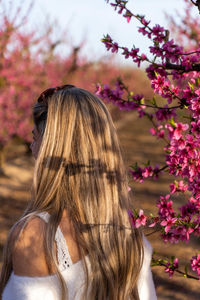 Rear view of woman with eyes closed