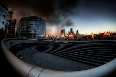 Cityscape against cloudy sky