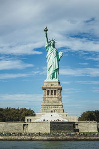 Frontal shot of the statue of liberty against sky