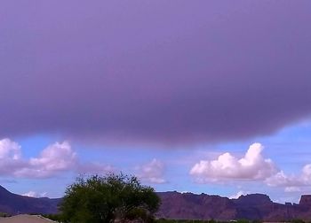 Scenic view of mountains against sky at dusk