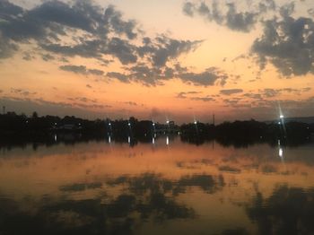 Scenic view of lake against sky during sunset