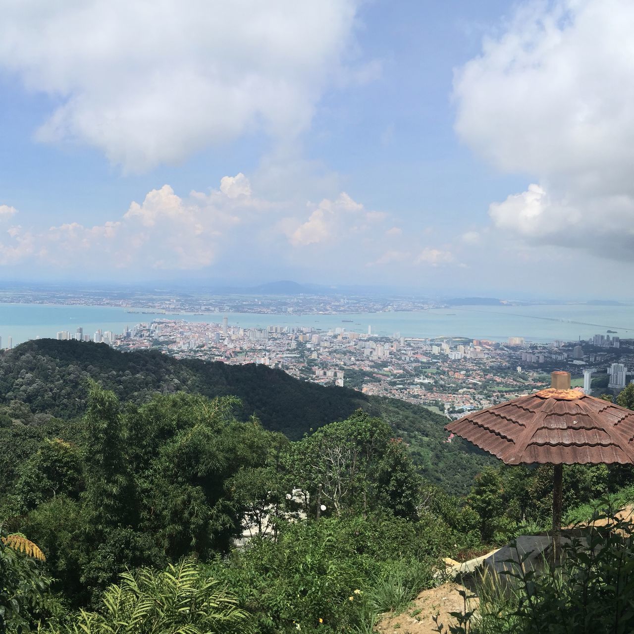 sky, sea, water, horizon over water, cloud - sky, scenics, tranquil scene, high angle view, beauty in nature, tranquility, cloud, building exterior, nature, built structure, cloudy, tree, architecture, landscape, day, outdoors