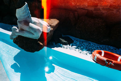 Close-up of hands in swimming pool