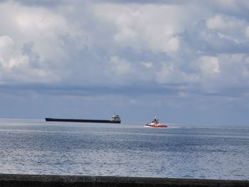 Nautical vessel sailing on sea against sky