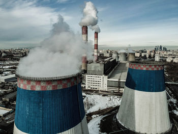 Cooling towers vaporing industrial district  aerial view