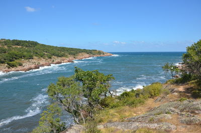 Scenic view of sea against blue sky