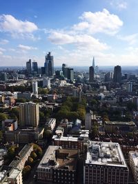 High angle view of modern buildings in city against sky