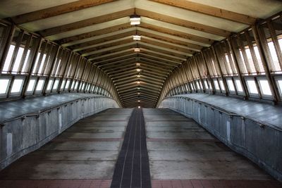 View of empty illuminated covering bridge