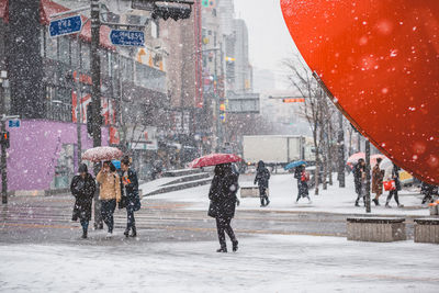 People walking on street during winter