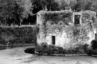 Abandoned building by trees