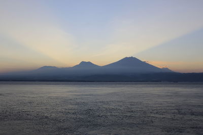 Scenic view of mountains against sky during sunset