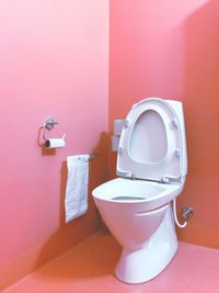 Close-up of electric lamp on wall at home