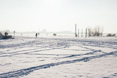 Scenic view of snow field against clear sky