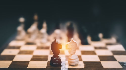 Close-up of chess pieces on table