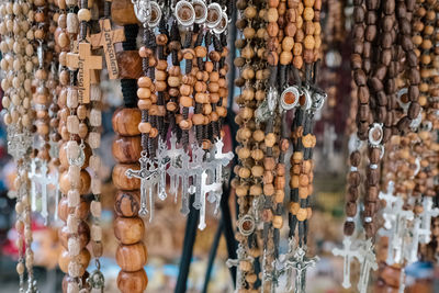 Close-up of rosaries for sale at market