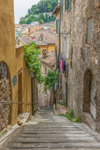 Narrow alley amidst buildings in town